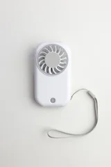 White Portable Mini Handheld Fan with Lanyard on White Background, Top View © stasknop