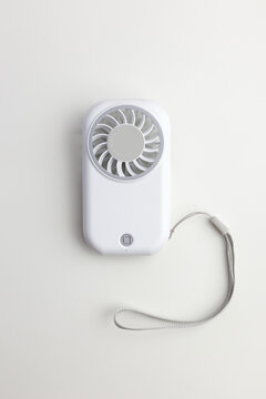 White Portable Mini Handheld Fan with Lanyard on White Background, Top View