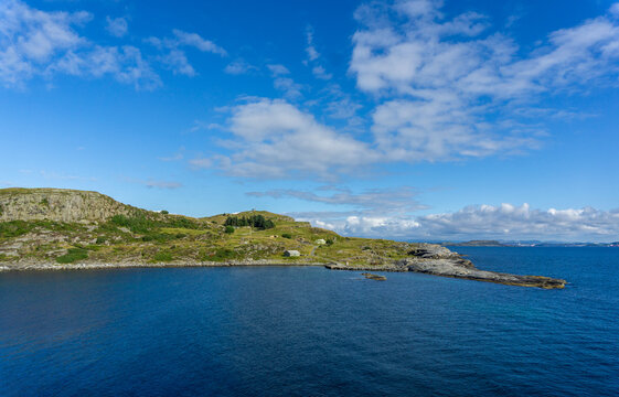 Fj&oslash;l&oslash;y Fortress coastline in Rogaland with blue ocean and sky
