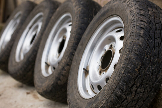 The car wheels are arranged in a row.