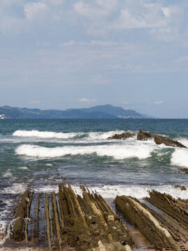 Unique Flysch rock platform revealed during low tide along the Basque Coast in Zumaia