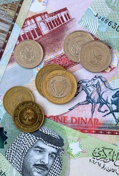 Bahraini dinar money banknotes and coins on table. Bahrain cash bills of BHD currency