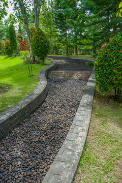 Stone pathway in garden and footpath in picturesque summer park and staircase in backyard,Paving stones on floor in park,Garden landscape design,space for text.