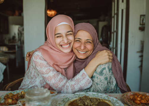 Joyful friends embracing during a religious festival celebration for Ramadan and Eid holiday concepts in a bright and cheerful lifestyle setting