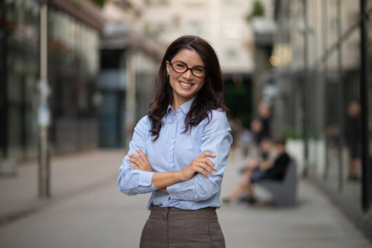 Businesswoman standing in urban setting feeling confident and successful