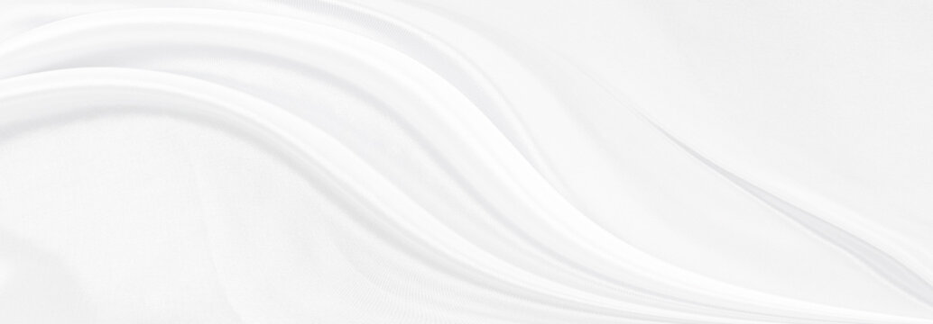 White gray satin texture that is white silver fabric silk panorama background with beautiful soft blur pattern natural.