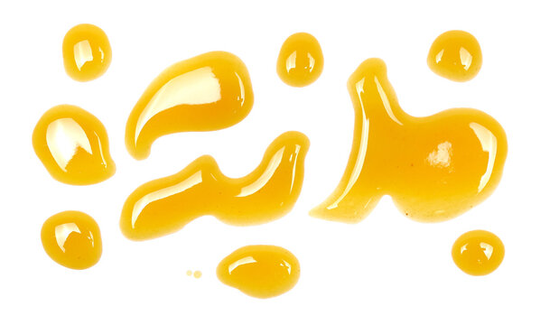 Spilled drops of fresh apple and peach juice isolated on white background, top view