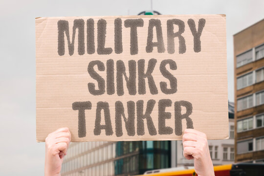 "Military Sinks Tanker" Naval forces deliberately destroy Iranian oil vessel in disputed waters. CONFLICT. MILITARY. IRAN. AGGRESSION. MARITIME.