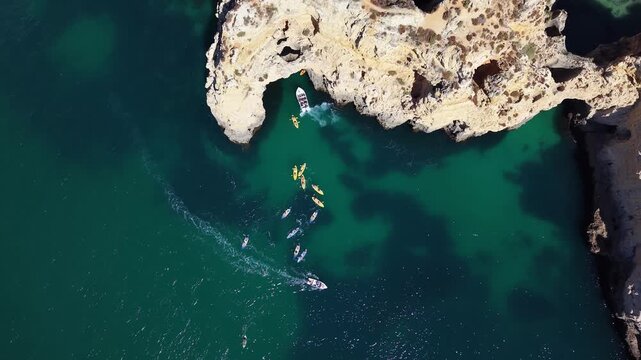 Aerial view of kayaks exploring ponta da piedade grotto