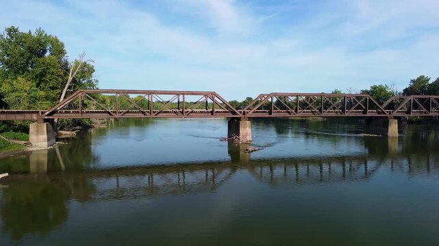 Aerial Drone View of a Railroad Bridge Across River in 4k