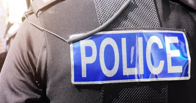 Police officer &ndash; emergency services law enforcement policeman in UK vest uniform. Involved in arrest, crime investigation and community support.