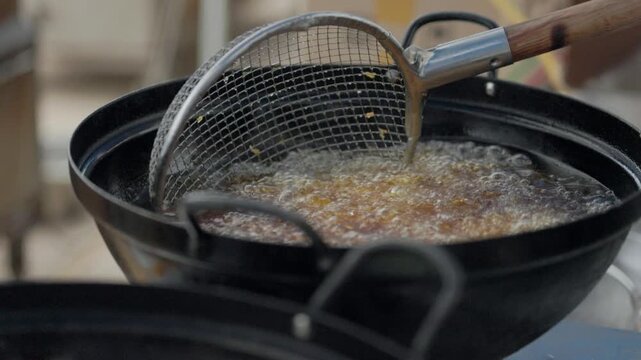 Food Frying in Hot Oil at a Traditional Festival