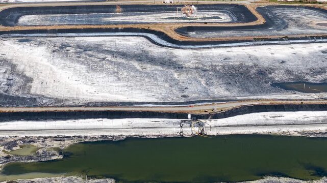 Aerial view of industrial sludge drying beds