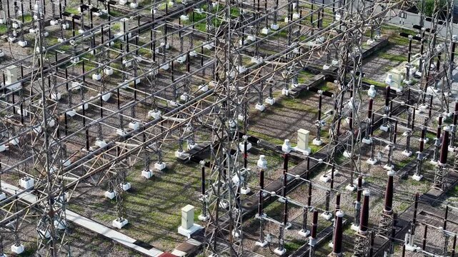 Aerial view of power substation. Rows of transformers and insulators dominate the frame
