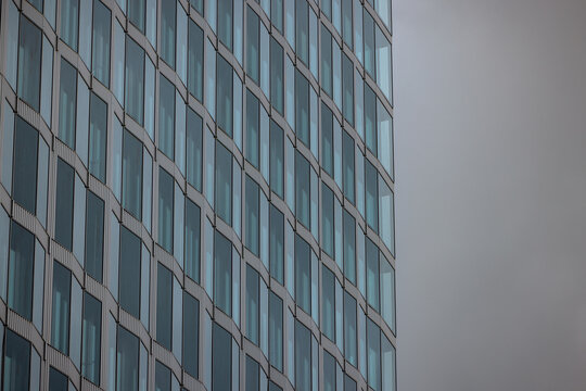 Berlin, Germany - July 5, 2026: Contemporary commercial architecture features geometric facades, repetitive window patterns and modern materials in central Berlin.