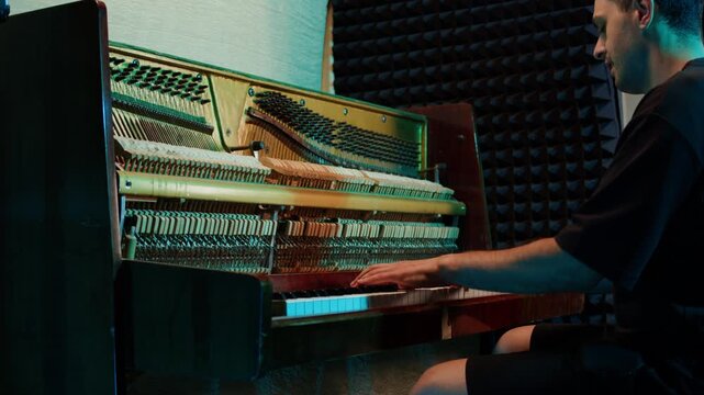Man playing and tuning piano, Old vintage piano hammers with strings close up, 
