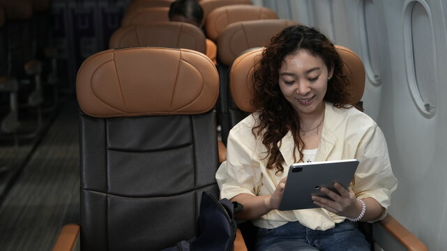 happy tourist girl on plane
