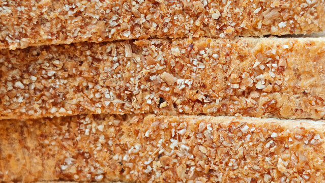 Whole wheat bread on wooden plate