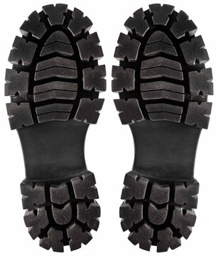 Isolated photo of black rubber male boot sole on white background.