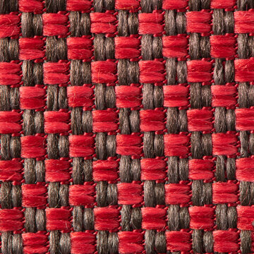 Close up of red and brown fabric texture with checkered woven pattern