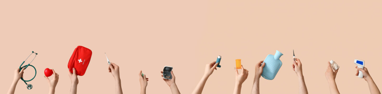 Healthcare access and medical support, diverse hands holding various health equipment and wellness tools for patient care on a beige background