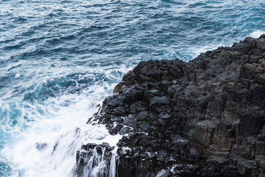 waves crashing on rocks
