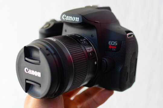 ZAPOPAN, MEXICO - SEPTEMBER 10, 2026: Hand holding a Canon EOS Rebel T8i camera.