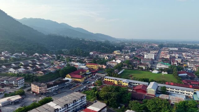 Aerial view shows a mountainous town with colorful buildings at Kampar
