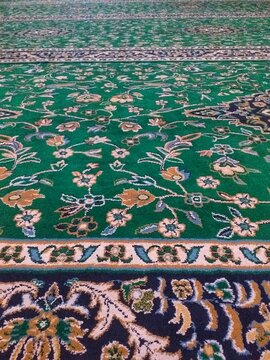 Vertical picture of home decor, fashion design, textiles, and wallpaper. Bold green floral pattern with intricate woven details for creative projects.