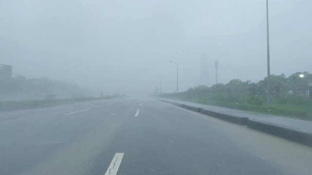 Driving In Extreme Hurricane Winds And Heavy Rain On City Road