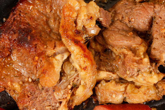 Juicy grilled beef steak with a tender texture and caramelized fat.