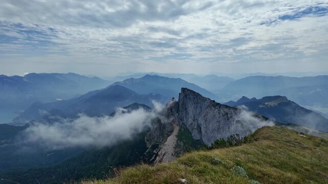 Aerial misty landscape, 4k footage. Aerial view of mountain landscape. Landscape panorama. Dramatic misty landscape with mountain in nature environment. Mountain peak aerial view