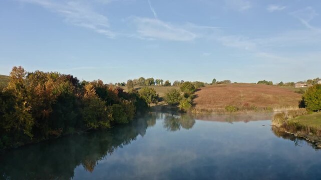 Aerial view of Morning Fog Over Small Lake Near Georgetown Kentucky