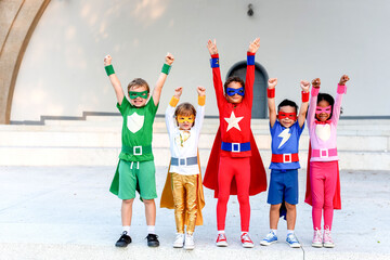 Obraz premium Children in colorful superhero costumes