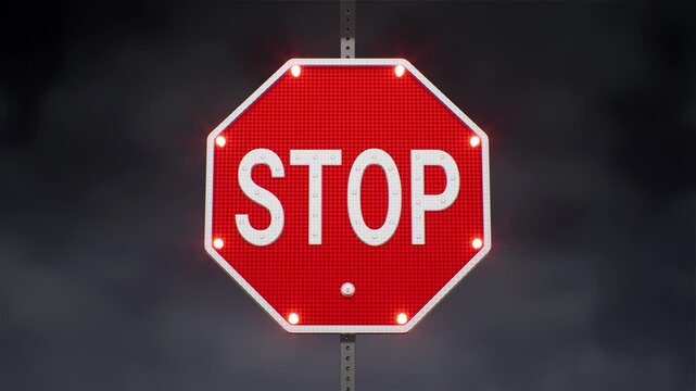 Standard red octagonal stop sign on a night street
