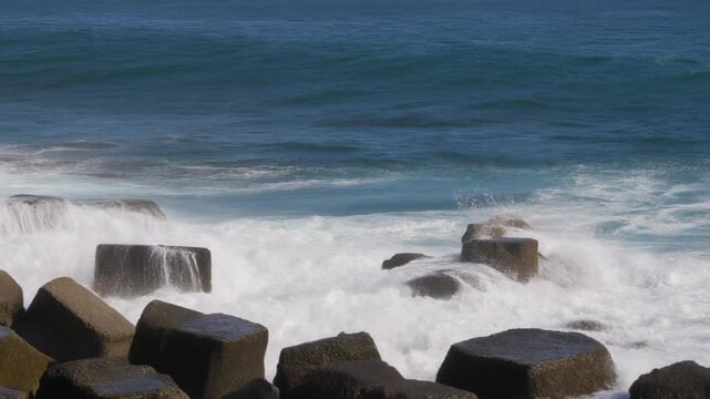 Biscoitos natural pools coastline with waves crashing on rocks