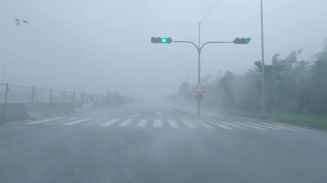 Driving Through Blinding Hurricane Rain And Strong Winds In City