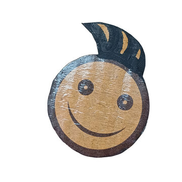 Circular cardboard cutout featuring a smiling face with a small tuft of hair on arranged on a white background, for craft projects isolated on a transparent background