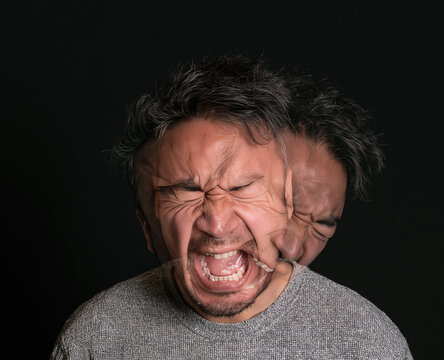 Man portrait with motion blur showing psychological stress and mental instability and agony during a breakdown