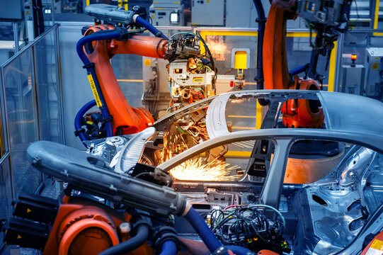 Automotive industry robotic arm assembly line