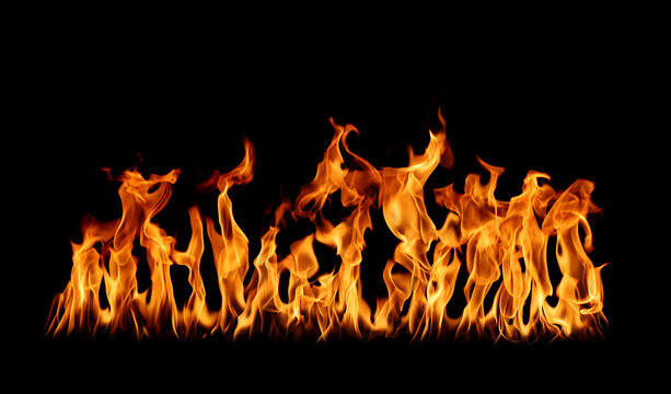Bright orange flames isolated on a black background, creating a dramatic fire texture for energy, heat, danger, burning, emergency, special effects, backgrounds, and creative design projects. visuals.