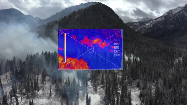 Thermal drone camera heatmap overlay detecting hot spots at mountain forest fire