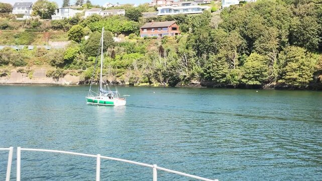 Passing a sailboat leaving Kinsale by boat