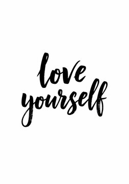 Inspirational handwritten phrase "love yourself" on white background.