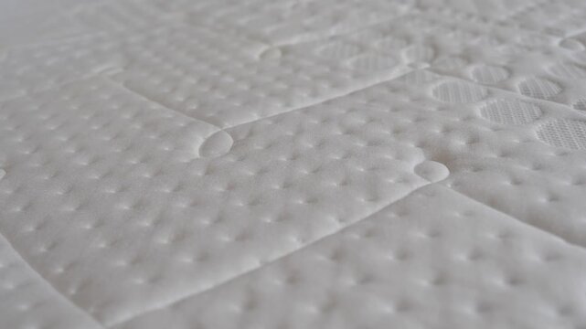 Close look at a textured mattress surface