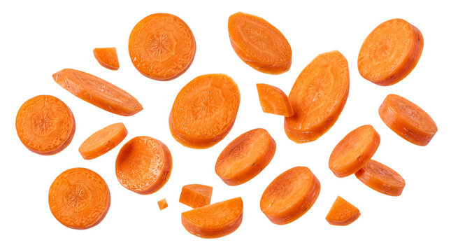 Assortment of fresh carrot slices and chunks isolated on png transparent background