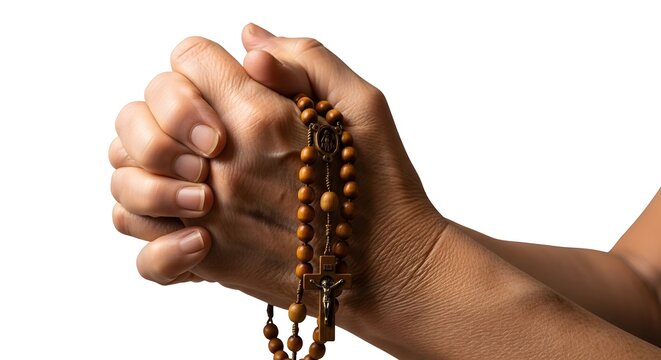 Hands praying with rosary beads during devotion against a clean studio background for spiritual concepts