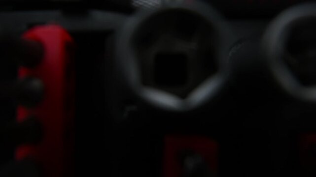 Close up view of a tool kit with multiple bits and sockets, organized and ready for use.