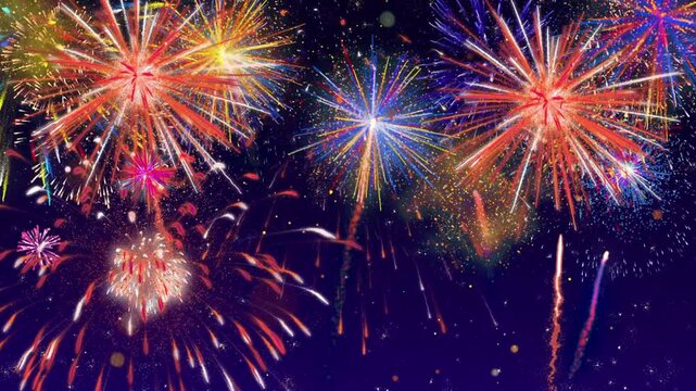 Vibrant fireworks display on dark night sky with colorful bursts of light and sparks flying high