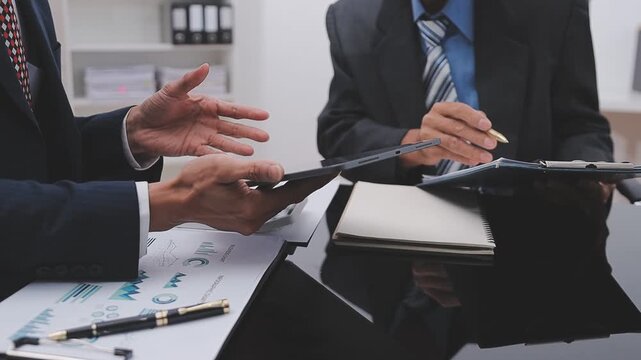Financial Businesswomen analyze the graph of the company's performance to create profits and growth, Market research reports and income statistics, Financial and Accounting concept.